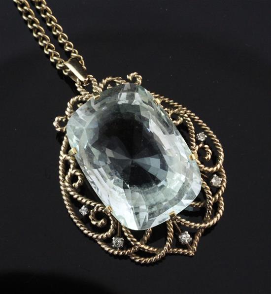 A 1970s gold, aquamarine and diamond pendant, pendant 1.75in.